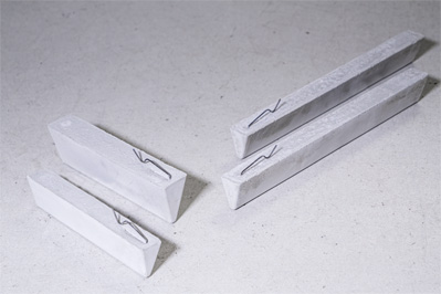 Cast concrete bar spacers